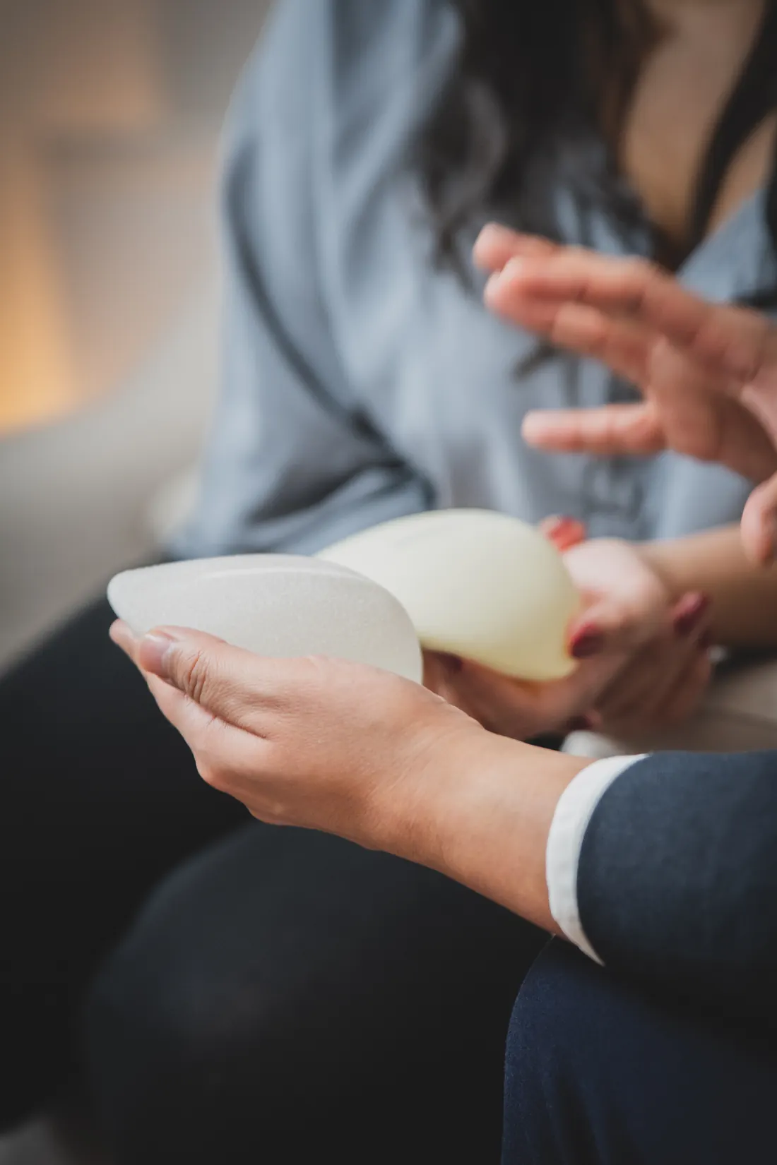 A patient consulting a breast implant surgeon