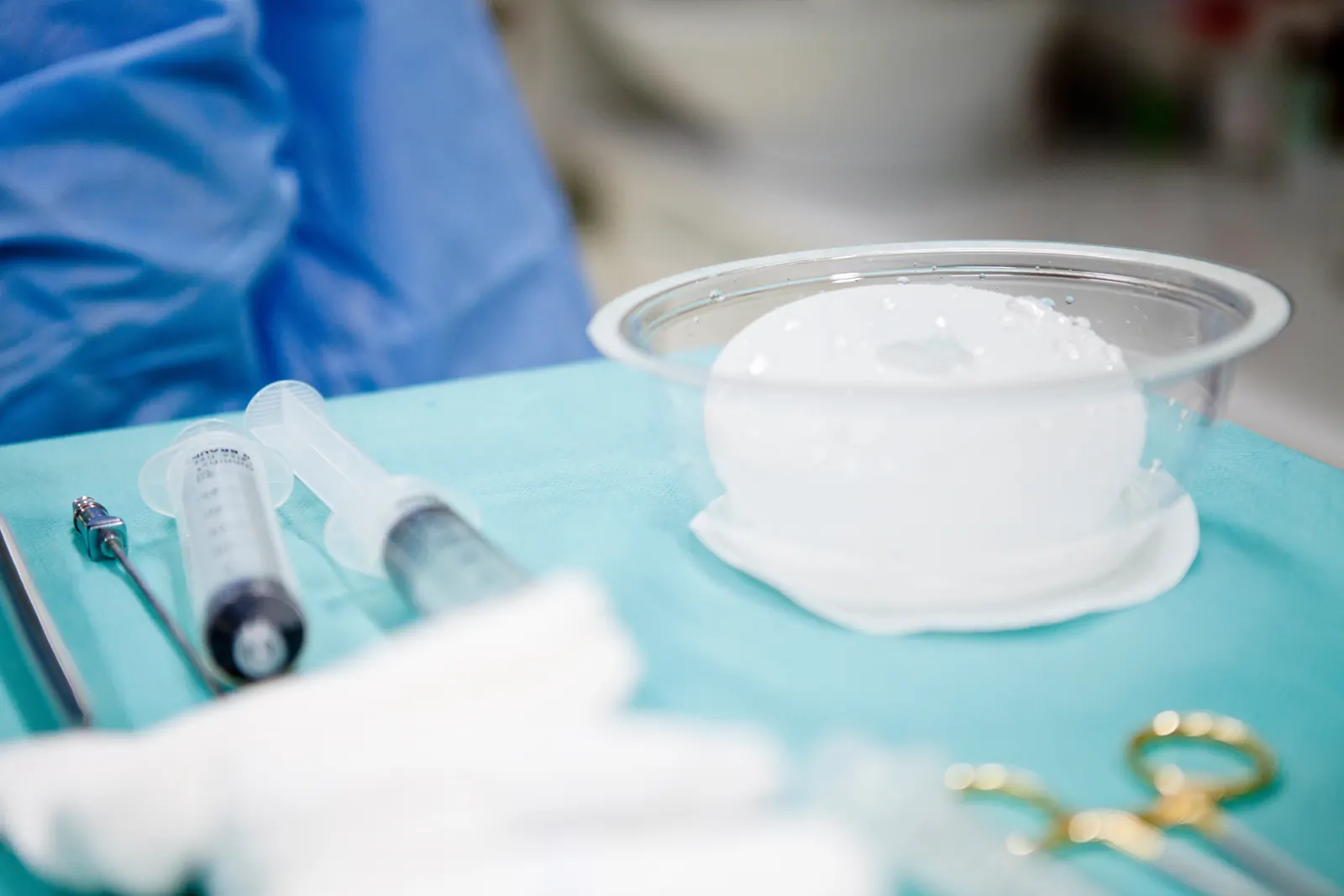 A sterile breast implant prepared on a surgical tray